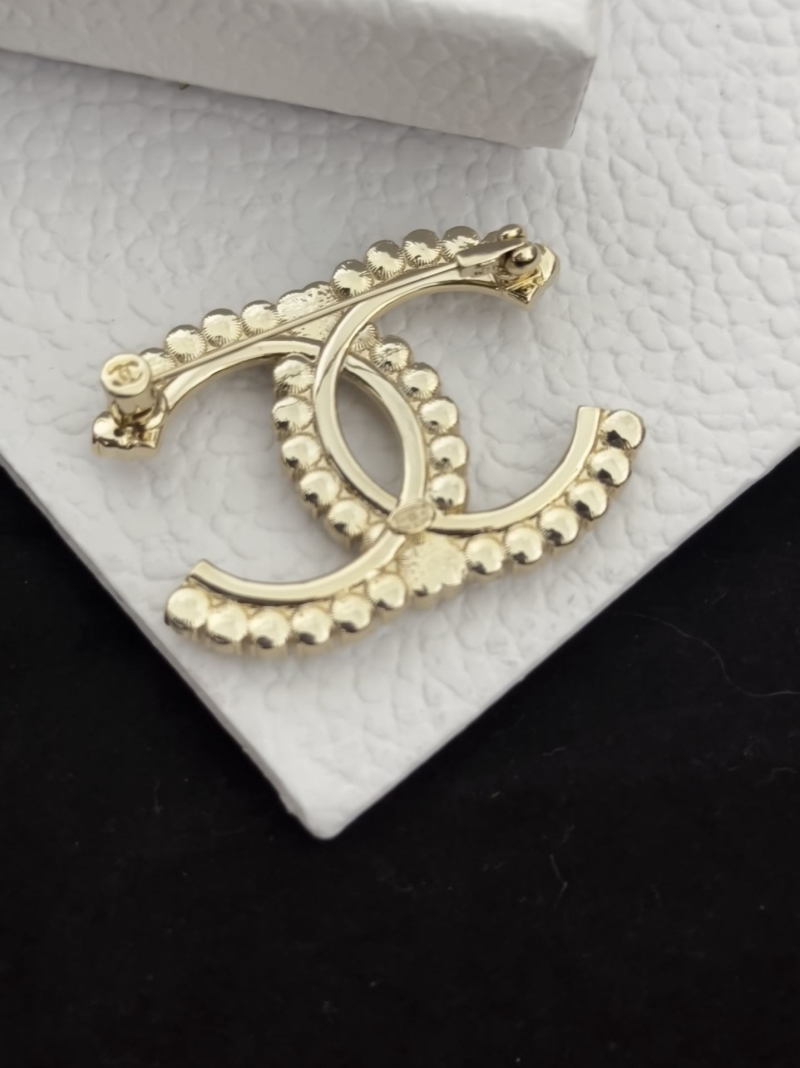 Ch**el brooches